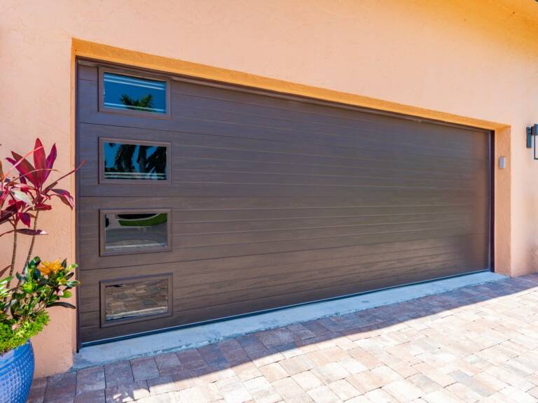 Hurricane Master Hurricane Garage Door - Close up double car DAB Door Garage Door brown model 824 grooved with impact resistant windows